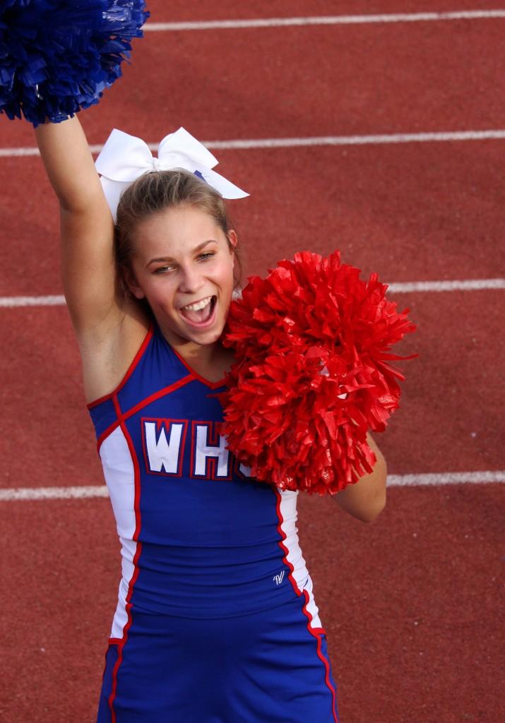 Freshman Peachie Keith cheers for the Westlake JV Blue team game against Cibolo Steele on Sept.19.