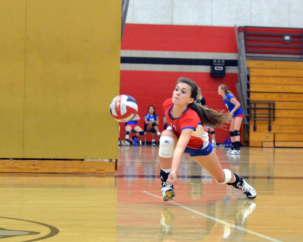 Senior setter Cece Burbach dives for a tip at the game against Bowie at Bowie on Oct. 4th. The Lady Chaps won the District match in three sets, making their record 5-1. (Gabbi Martinez)