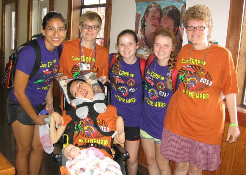 (Left to right) Counselor Patricia Flores, camper Carrie Pyka, counselor Margaret Norman, counselor Olivia Norman, camper Lindsey Pyka and (bottom) camper Zelina Escobedo stand together in the dining hall on the last day of camp.