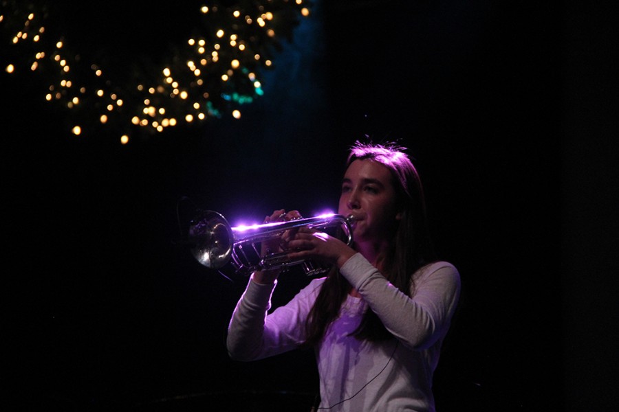 Band president senior Ginger Hooper plays the trumpet during the Nutcracker rehearsal on Dec. 9.