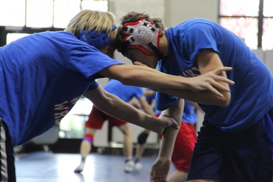 Wrestling players battle head to head in hope of succeeding and taking each other down to the mat.

by Jake Breedlove