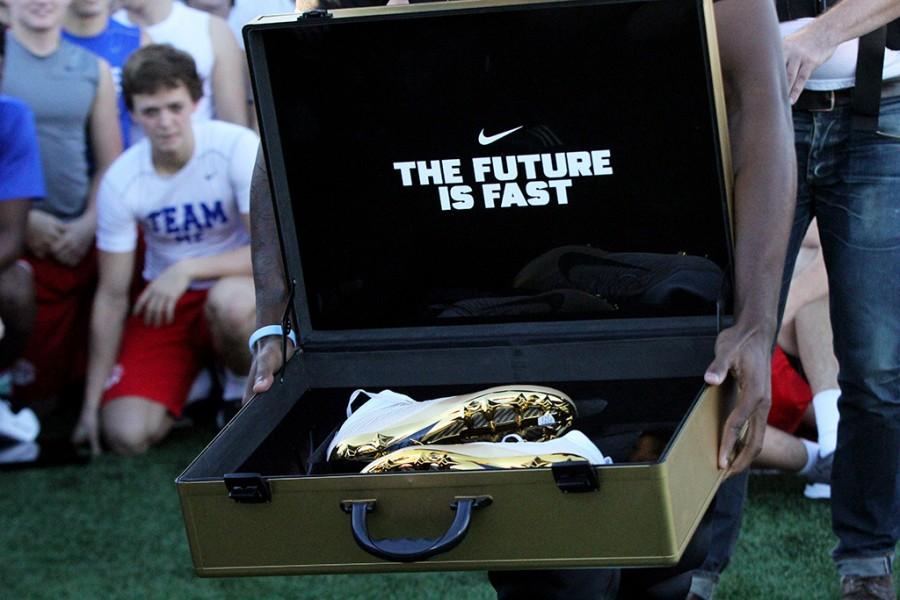 Nike representative reveals cleats to the varsity football team on Monday, Dec 14.
