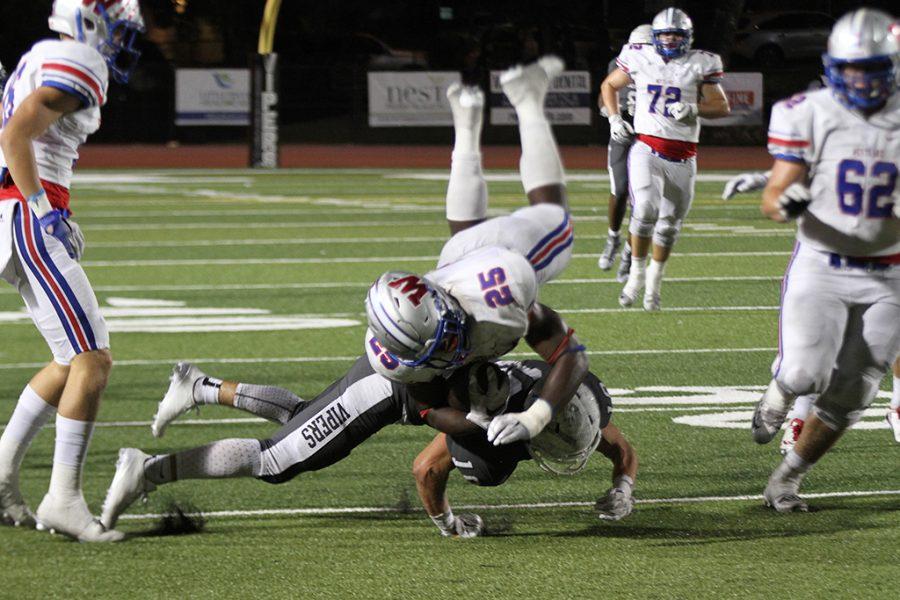 Junior Nakia Watson collides with a Vandergrift defender during the game at Vandergrift on August 23.