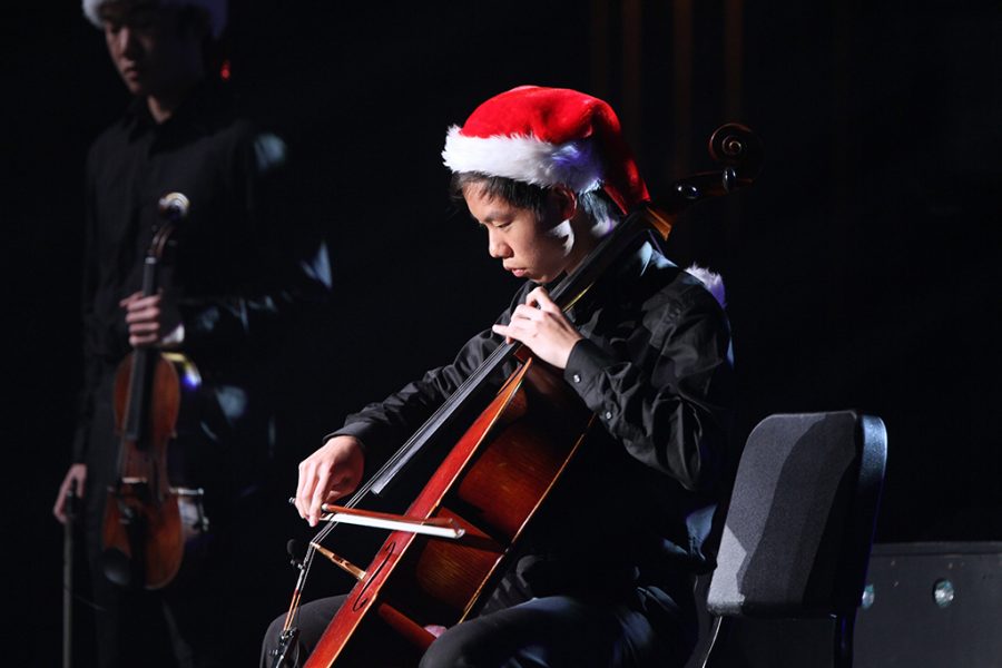 Senior Ryan Zhou plays the cello during the Winter performance of Nutcracker on Dec. 10.