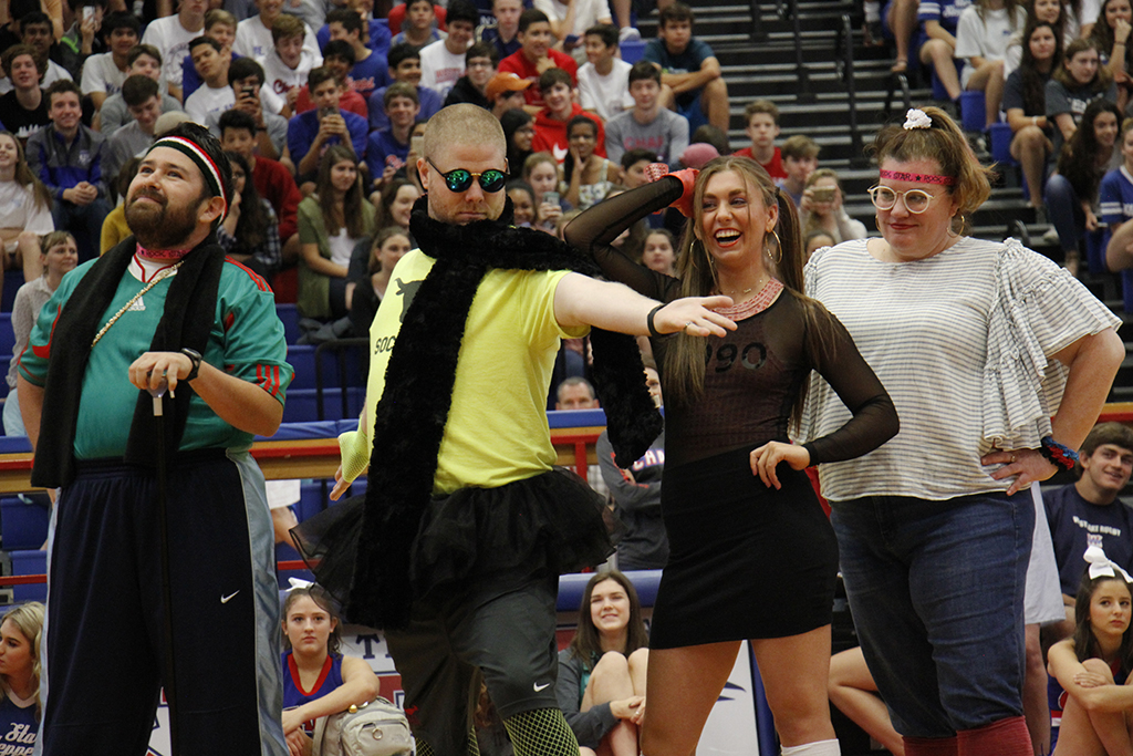 Armando Vazquez, Dale Baker, Perry Rickard, and Cathy Cluck danced to Wannabe by The Spice Girls during the spring pep rally.