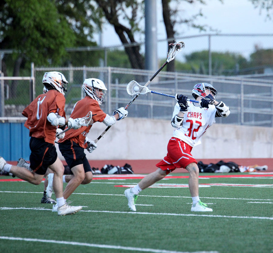 Varsity Mid-fielder Preston Henley intensly shoots the ball in hopes of making a goal.

by jake breedlove