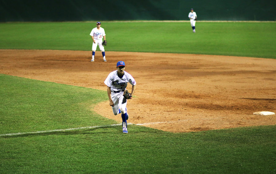 Senior Joe Palmo runs back to his position during a game against Lake Travis March 24.