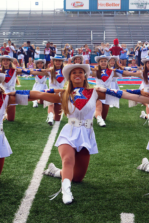 Senior Libby Mcfarland smilies wide while dancing on Westlake Hyline at the Homcoming PepRally on Sep. 22. Westlake Hyline performs at many pep-rallys and football games during the school year.