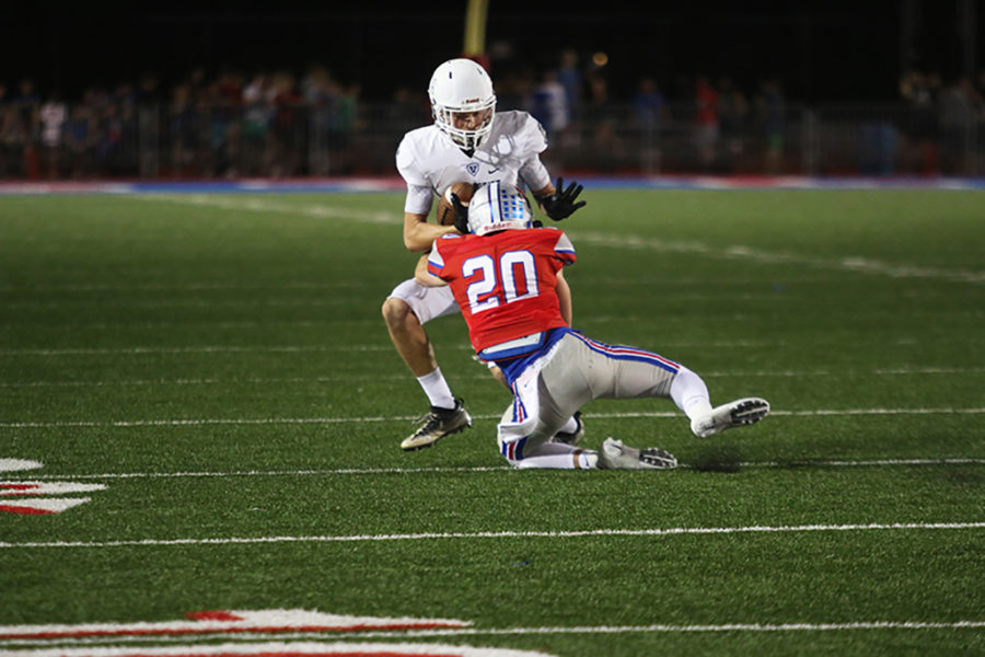 Varsity defensive back senior Collin Swalllow successfully tackles Viper reciever, preventing the Vipers from gaining any more yardage.

-jake breedlove
