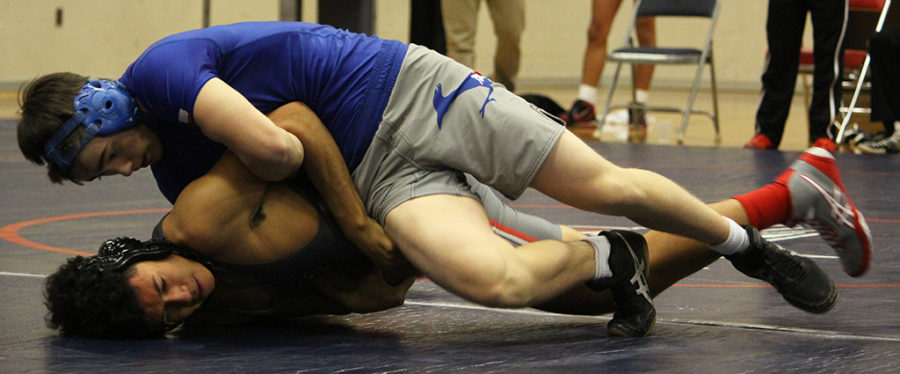 Senior+Liam+Ziaja+wrestles+against+Bowie+wrestler+attempting+to+pin+him+to+the+mat+at+Westlake+on+Dec.+6.