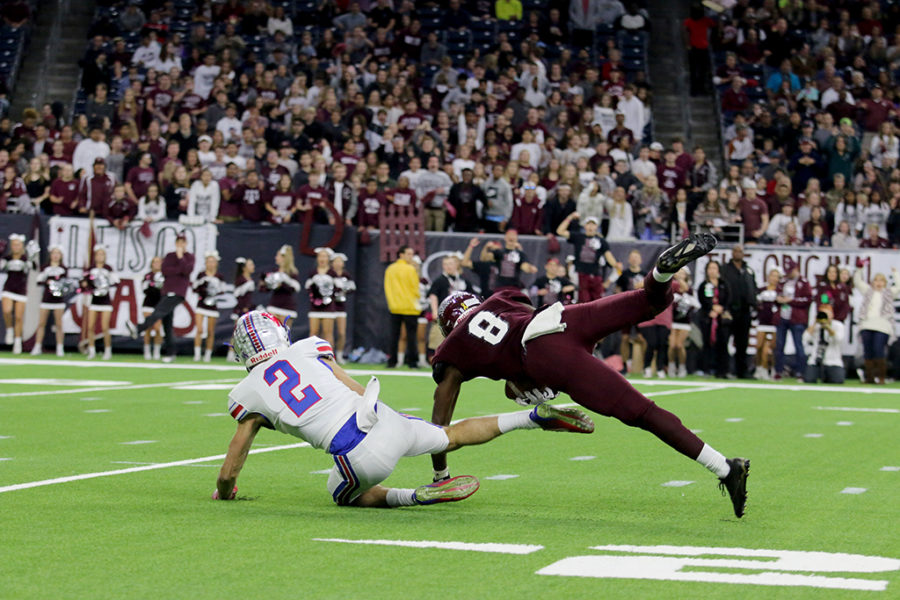 Senior wide receiver Jake Ramos attempts to receive pass thrown by junior quarterback Taylor Anderson, but sadly Cy Fair defender intercepts the ball.

by Jake Breedlove