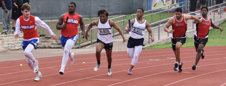 Seniors Jake Ramos and Nikia Watson run the 4 x 100 m relay Feb. 24 at the Chap Relays.