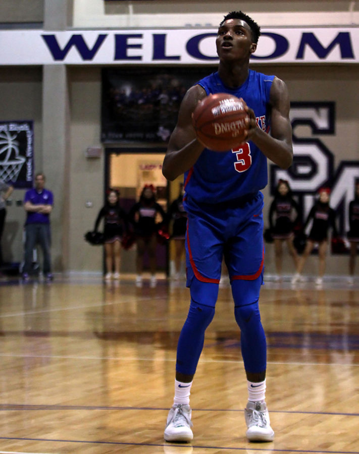 Senior Guard Keonte Kennedy shoots a free throw at the Regional Quarterfinal Playoff between Westlake and Wagner. Westlake went away victorious with a score of 58-57.