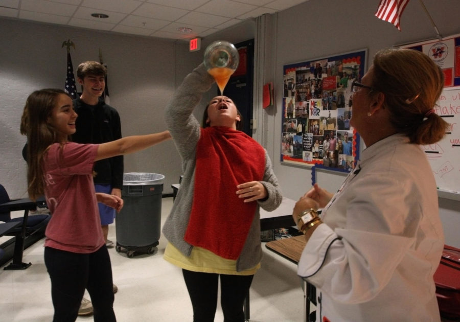 Sophmore Allison Ormand makes an attempt at drinking the virgin sangria at the Spanish Club Nov. 27 meeting. Spanish Club celebrates the Spanish culture and langauge at their monthly meetings.