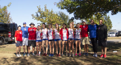 The girls varsity cross country team, coaches and principal Steve Ramsey pose after the Chaps placed 11th at State Nov. 9. 