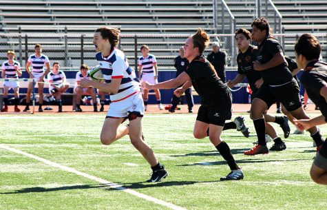 Junior Sam Schaffer runs with the ball during the rugby game against St. Pius X High School Feb. 1. Westlake won the game 35-5.