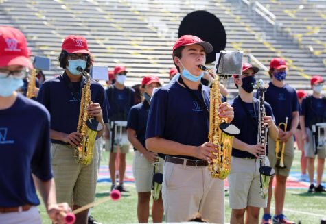 Performing at the Westlake Chaparral Marching Band Showcase Oct. 10, junior Dravin Raj and sophomore Manuel Rosso play the alto saxophone, and junior Mitchell Knipp plays the clarinet.