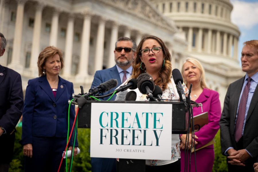 In this photo provided by Alliance Defending Freedom, Lorie Smith speaks at a Washington, D.C. news conference earlier this year.