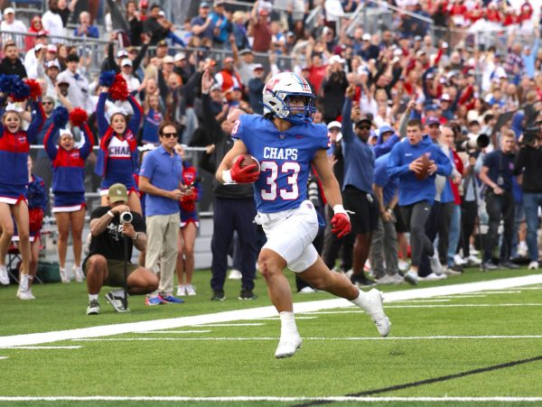 Running back senior Jack Kayser runs for a touchdown in the third quarter of the Chaps playoff loss to North Shore at Pfield Dec. 9. The score was Kaysers 76 of his Westlake career and 11 of the playoffs.