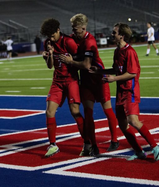 Forward senior Christian Mezas celebrates a goal with teammates in the second half of the Chaps 2-0 playoff win over Round Rock Tuesday, March 26 at Chaparral Stadium. Mezas scored twice, leading the Chaps to the victory. 
