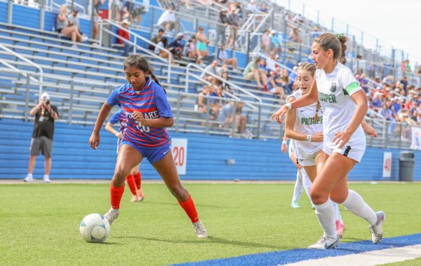 Forward junior Mia Berry dribbles around defenders in the Chaps 1-0 loss to Prosper in the UIL 6A Girls Soccer State Championship game at Birkelbach Field Saturday, April 13. The title game appearance was the first time the Chaps have made the championship since 1996. 