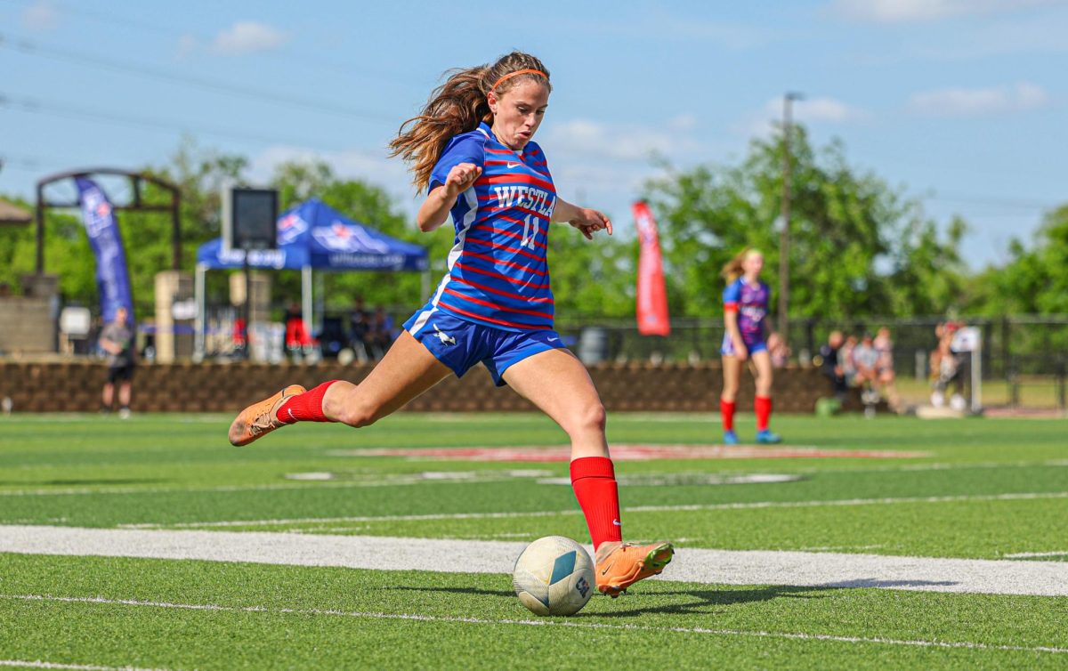 Defender sophomore Ade Nelson plays a pass in the Chaps 1-0 loss to Prosper in the UIL 6A Girls Soccer State Championship at Birkelbach Field Saturday, April 13. The appearance was the first time the Chaps made the title game since 1996. 