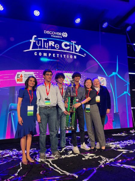 Future City Engineering team Ampere, made up of freshmen Aditya Gullapalli, Arya Gullapalli, Arnav Srinivasa and sophomore Miranda Xu, coached by Taryna Patel and Carol Reese with the first place trophy at Future City Engineering Global Finals  in Washington D.C. Feb. 20, 2024. Winning the grand prize, Ampere received $3,500 for the school’s STEM program and $10,000 of scholarship money per student. 