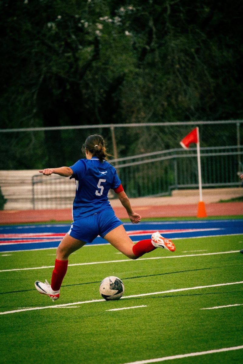 Senior Gabby Jatinen taking a shot at the goal at Chaparral Stadium, Tuesday, March 19. Jatinen had been working as a team player the whole game, now granting her own time to shine. 