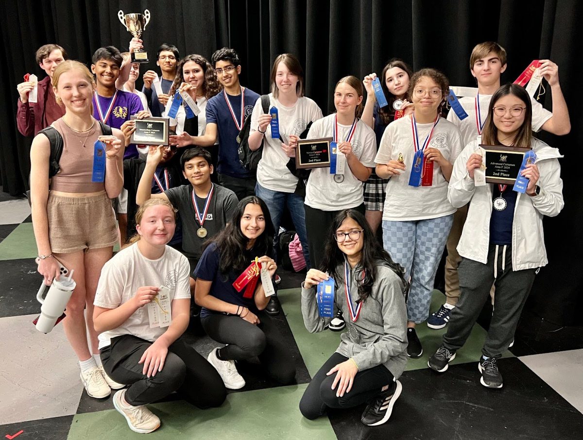 Award winning students pose for photo with their medals. Students won medals for competitions including vocabulary and grammar to ancient mythology. 