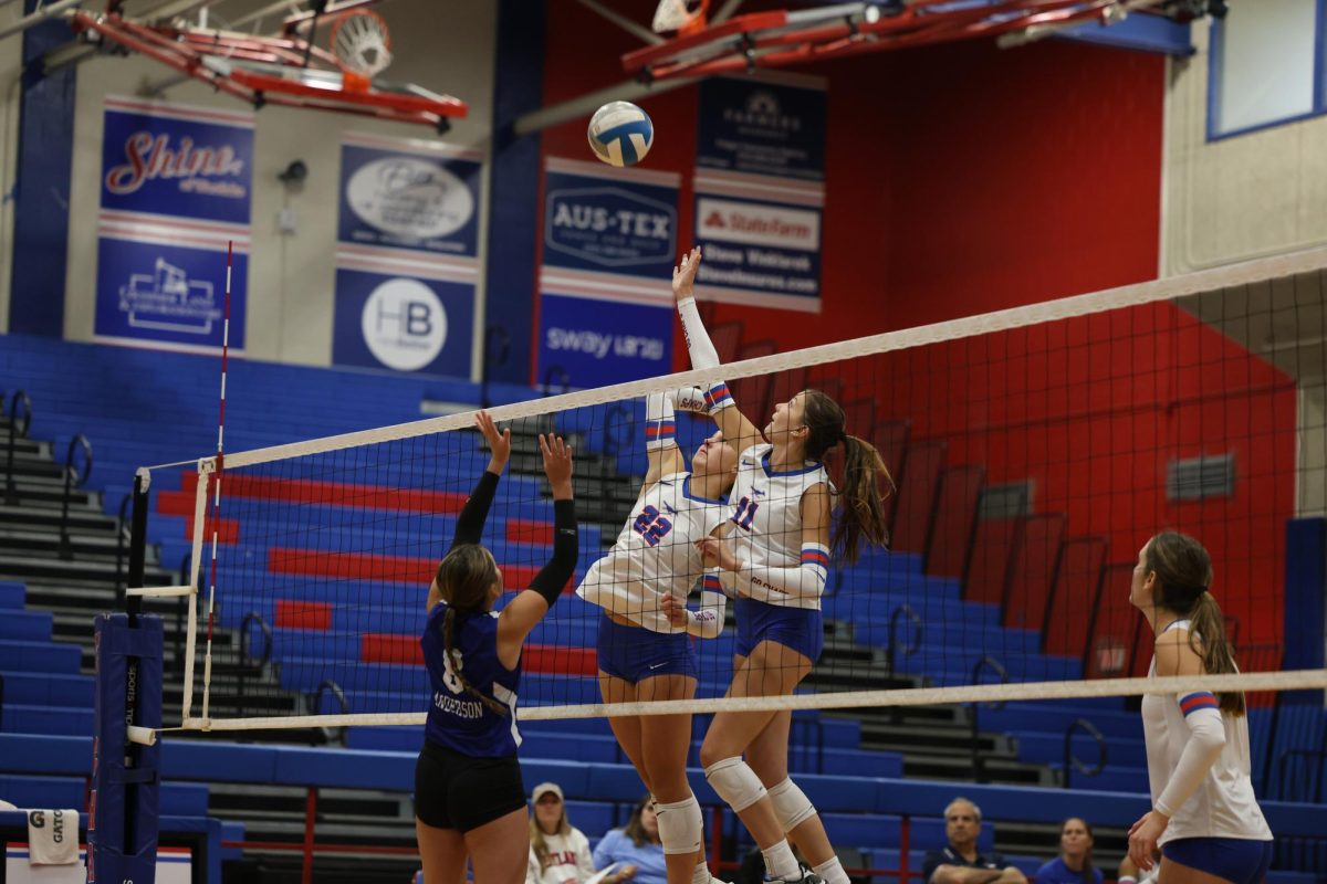 Junior middle blocker Sydney Yohe skies up for a spike against Anderson Sept. 10. Yohe is committed to play volleyball at the University of Texas A&M-Corpus Christi