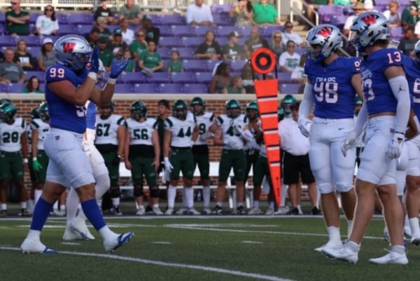 The Chaparral defense celebrates a big tackle against Prosper Aug. 29. The Chaps defense has numerous division one recruits.