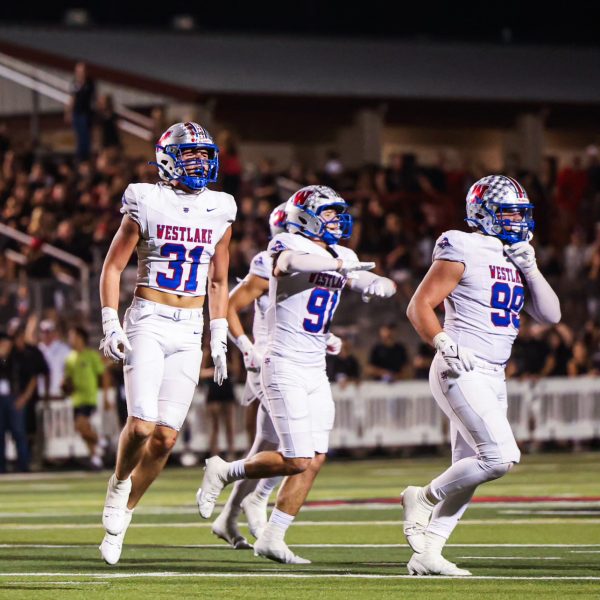 Senior linebacker Elliott Schaper celebrates a sack against Lake Travis Oct. 25 at Cavalier Stadium. The Chaps won their fifth straight game against the Cavs