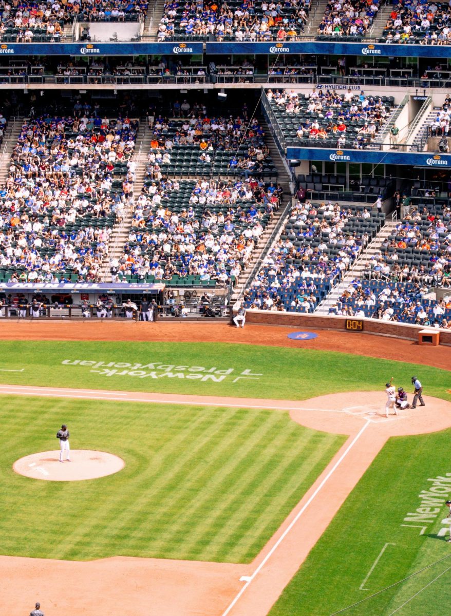 Mets pitcher Luis Severino pitches next to a massive advertisement at Citi Field. Severino is currently pitching in the MLB postseason. 