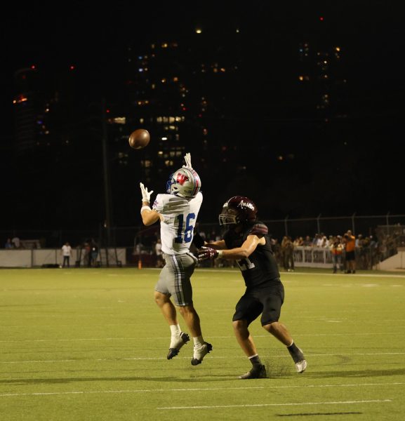 Senior wide receiver Cash Robin skies for a catch against Austin High Oct. 10. The Chaps remained undefeated in the district with a 49-7 win. 