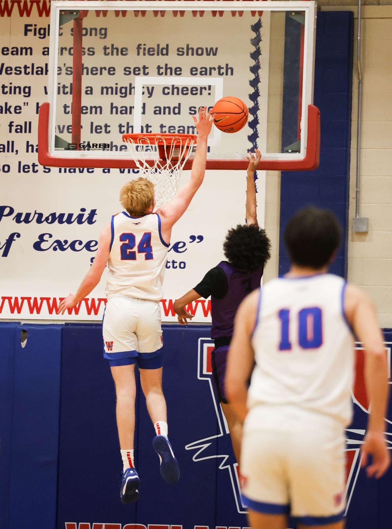 Senior forward Jack Seiders leaps for a chase down block against University Nov. 12. On Al Bennett Court. Seiders turned in a double-double, with 16 points and 12 rebounds