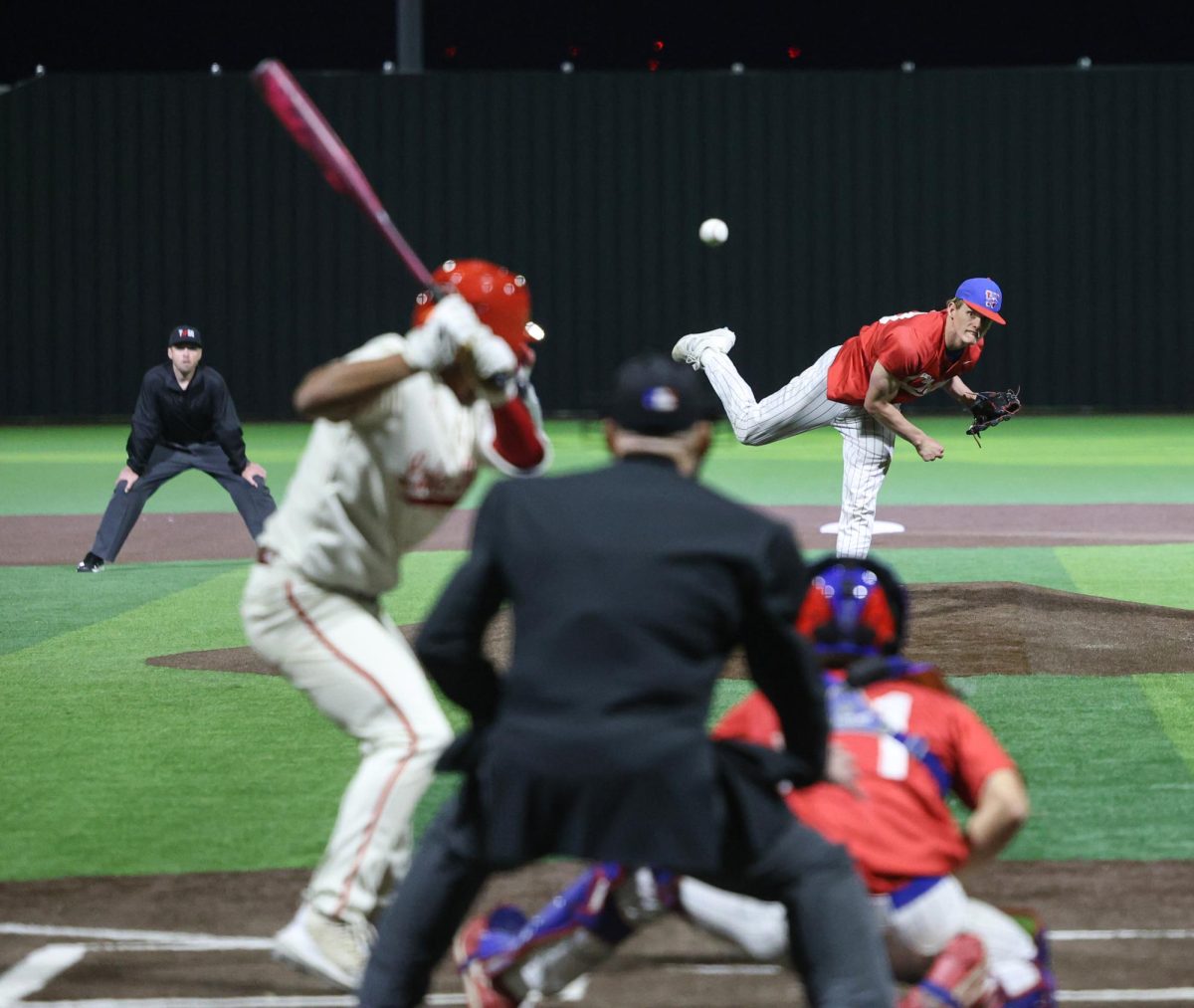From the mound, pitcher junior Parker Saltsman throws a pitch to the Lake Travis batter April 8. 