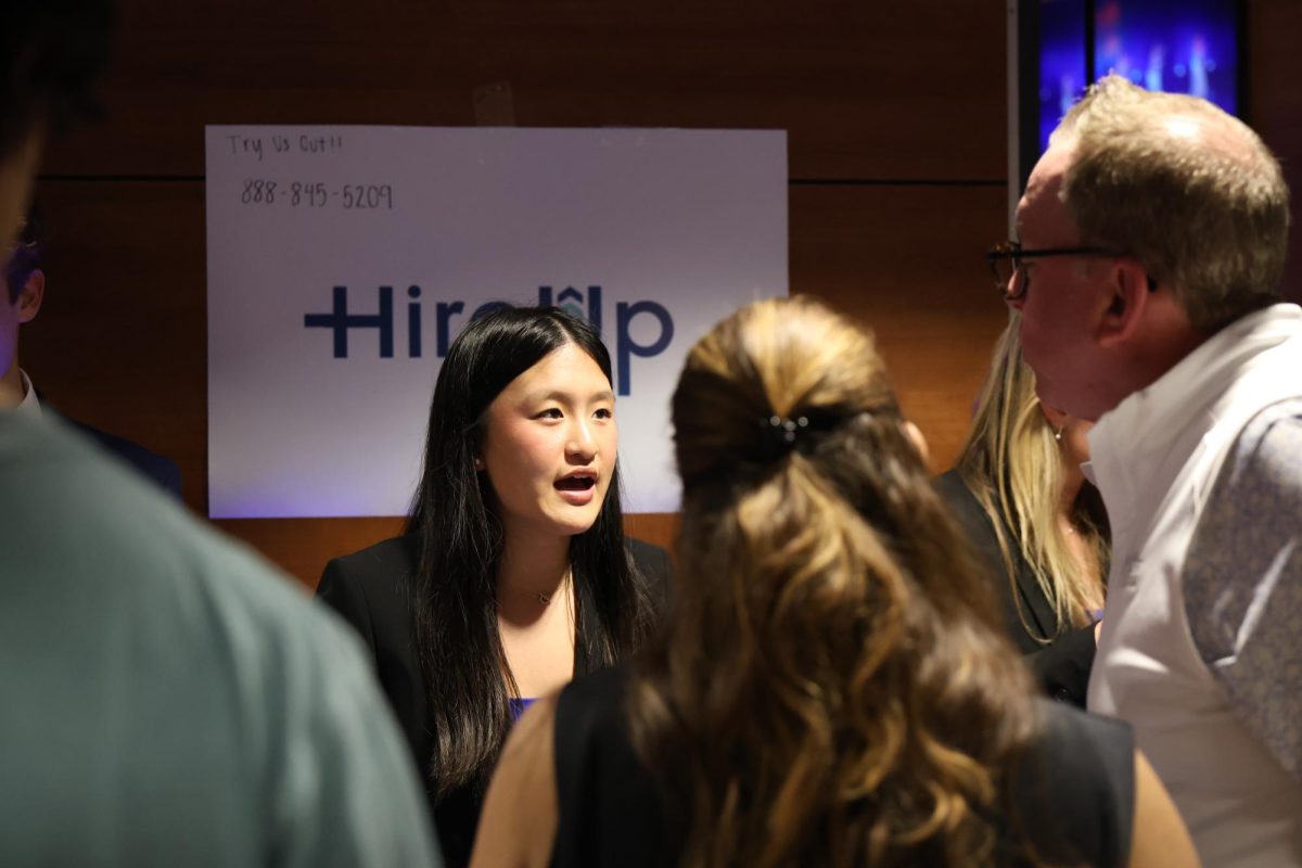 Explaining her team's business, junior Brooklyn Lee competes for a place in pitch night April 30. Her team HireUp was one of the Wild Card teams that competed for a place on Pitch Night.