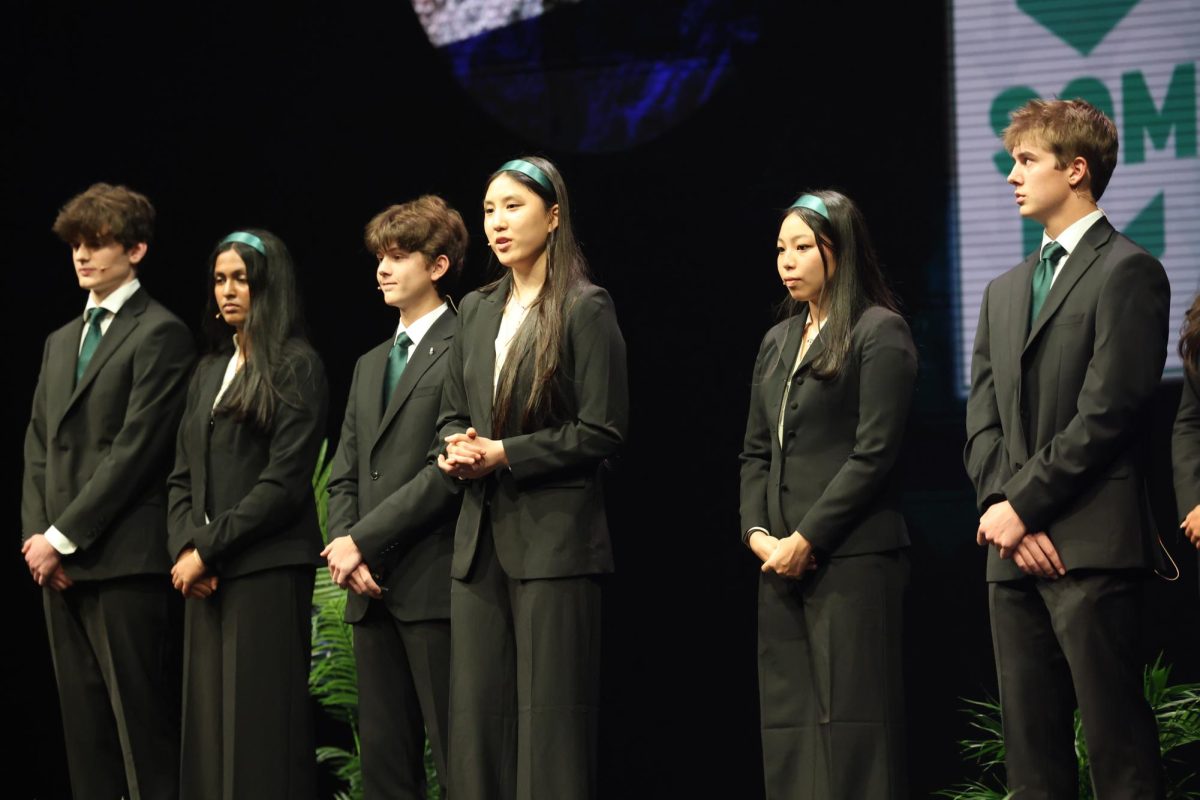 Standing in front of the audience, business incubator group Fantasy Funds pitches their idea to the judges. After delivering their pitch, they secured second place and won $8,000.
