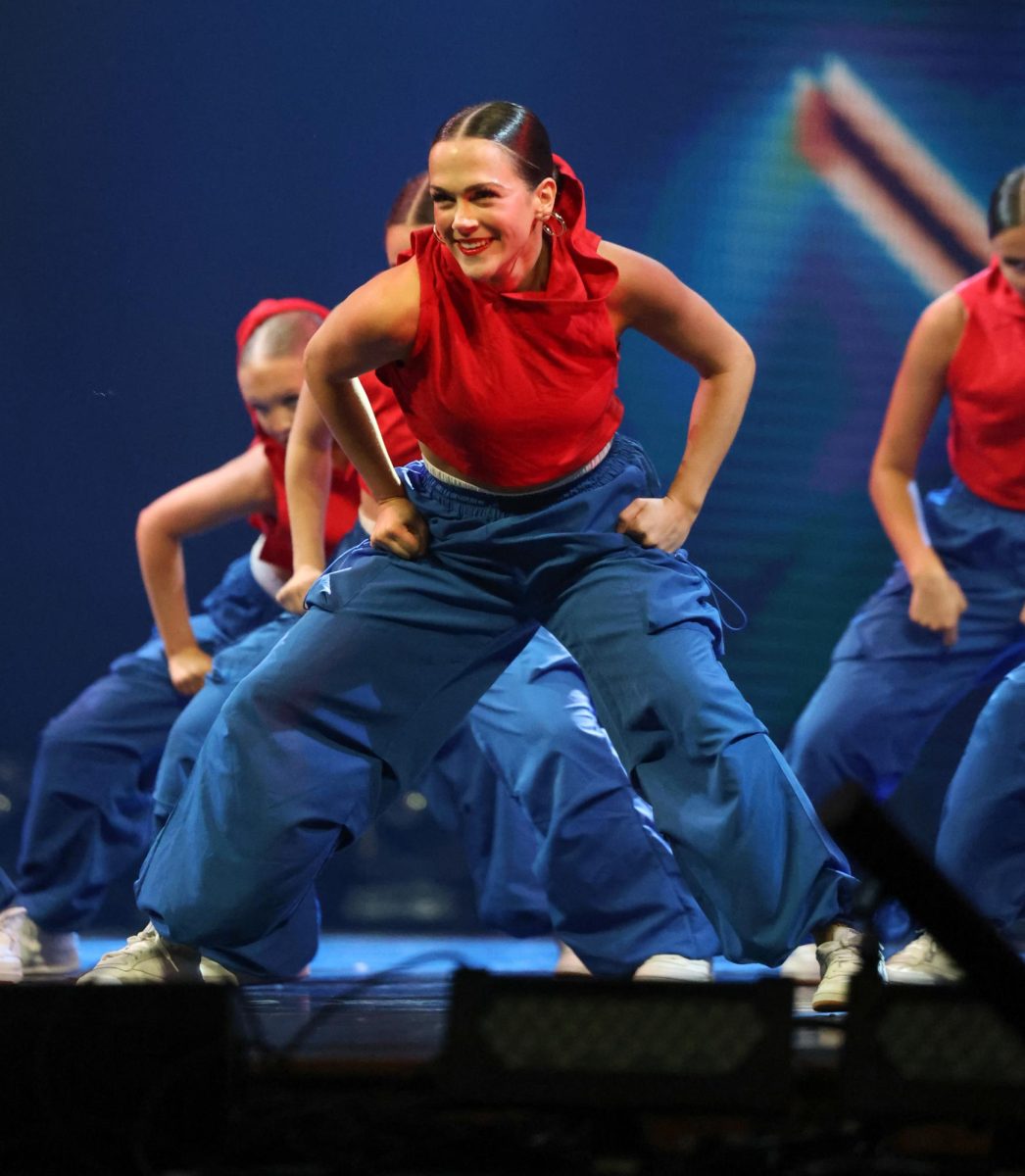 Hyline president senior Rylan Weatherford dances with the Funky Co team in Zenith April 26.