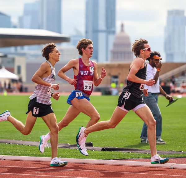Keeping his pace in the 1600 m, junior Grant Seade competes in the Texas Relays March 29. Seade finished with a time of 4:14.88, just hundredths of a second shy of the school record of 4:14.69.