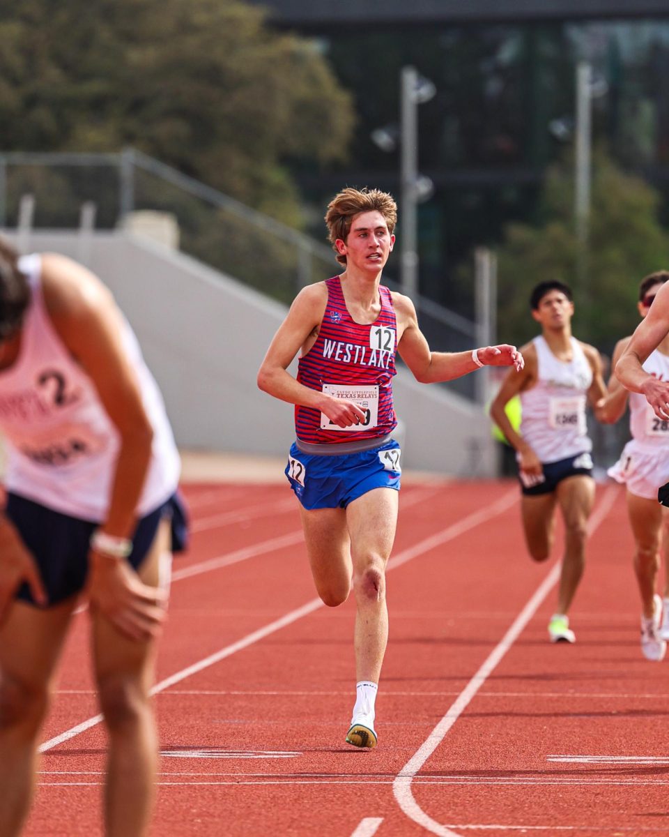 Just across the finish line, junior Grant Seade catches his breath after placing fifth at the Texas Relays March 29. Seade finished with a time of 4:14.88, just hundredths of a second shy of the school record of 4:14.69.