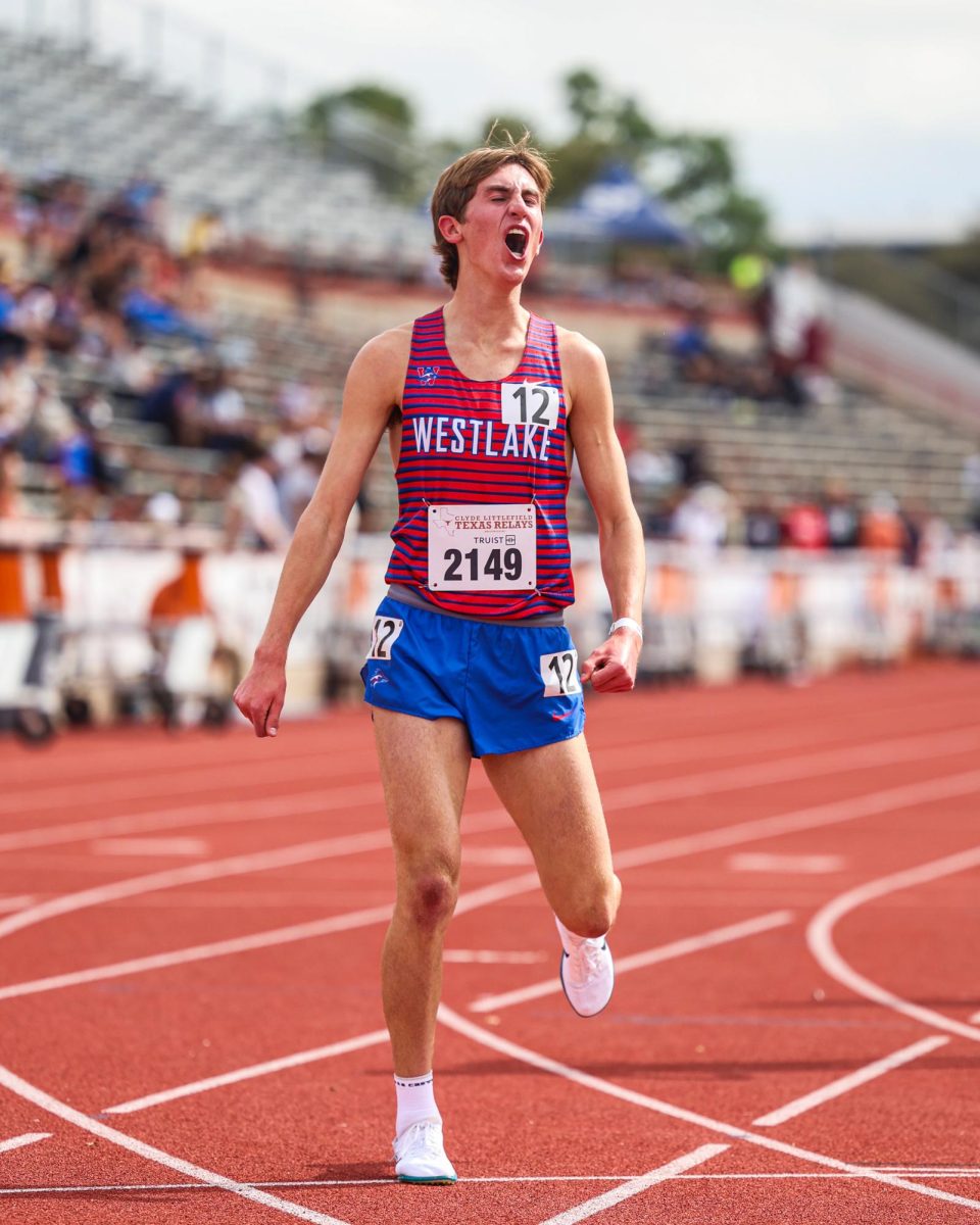 Celebrating his finish in the 1600m, junior Grant Seade placed fifth at the 97th Clyde Littlefield Texas Relays March 29. Seade finished with a time of 4:14.88, just hundredths of a second shy of the school record of 4:14.69.