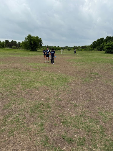 (From left) Seniors Andrew Han, Alan Cortes-Leon, Leo Alcala and Kiefer Mason playing soccer at their designated location after organizing a shipping container and a closet. The group volunteered at Gus Garcia Recreation Center as part of Westlake High School’s Senior Service Day on April 30.
