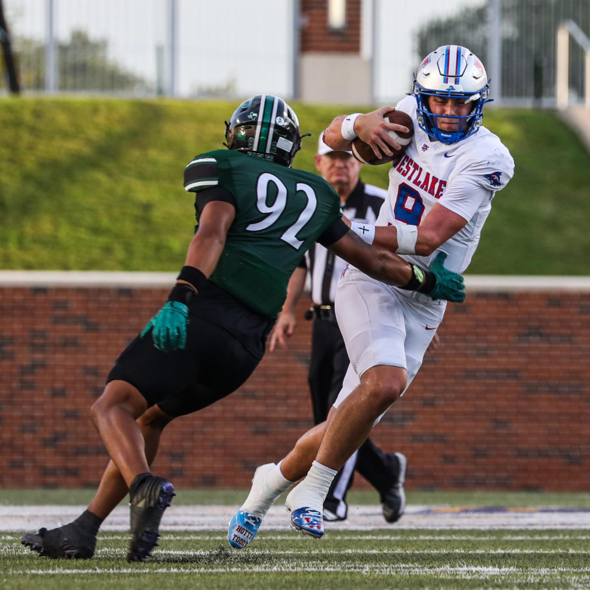 As he makes a move, quarterback senior Rees Wise breaks past the Prosper defensive line in the Chaps’ 22-29 loss Aug. 29. The Ole Miss commit carried the ball 7 times for 42 yards and a touchdown.