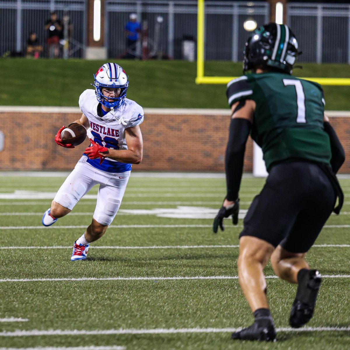 Turning upfield, wide receiver junior Braden Riddell races for the endzone in Westlake’s season opener Aug. 29. The Chaps fell 22-29 to the Eagles.