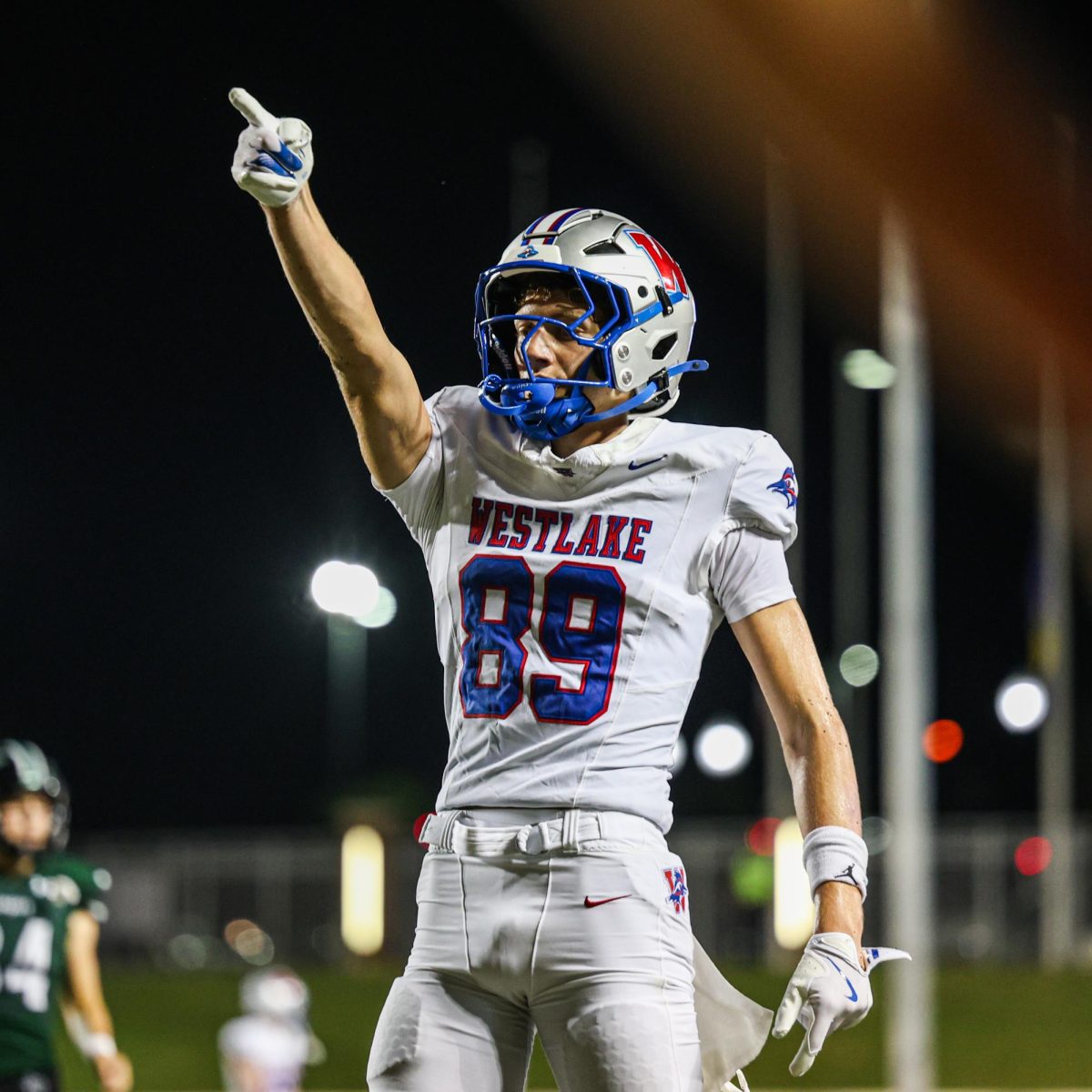 Hand in the air, wide receiver senior Jack Newhouse signals for a first down in the Chap’s season opener against Prosper. Newhouse hauled in four catches for 82 yards in Westlake’s 22-29 loss, adding another touchdown in the third quarter. 