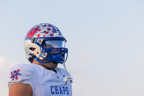 Senior defensive lineman Maddox Flynt warms up prior to the Chaparrals 66-0 victory over the Akins Eagles at Burger Stadium Oct. 2. (Andrew Stout/Westlake Featherduster)
