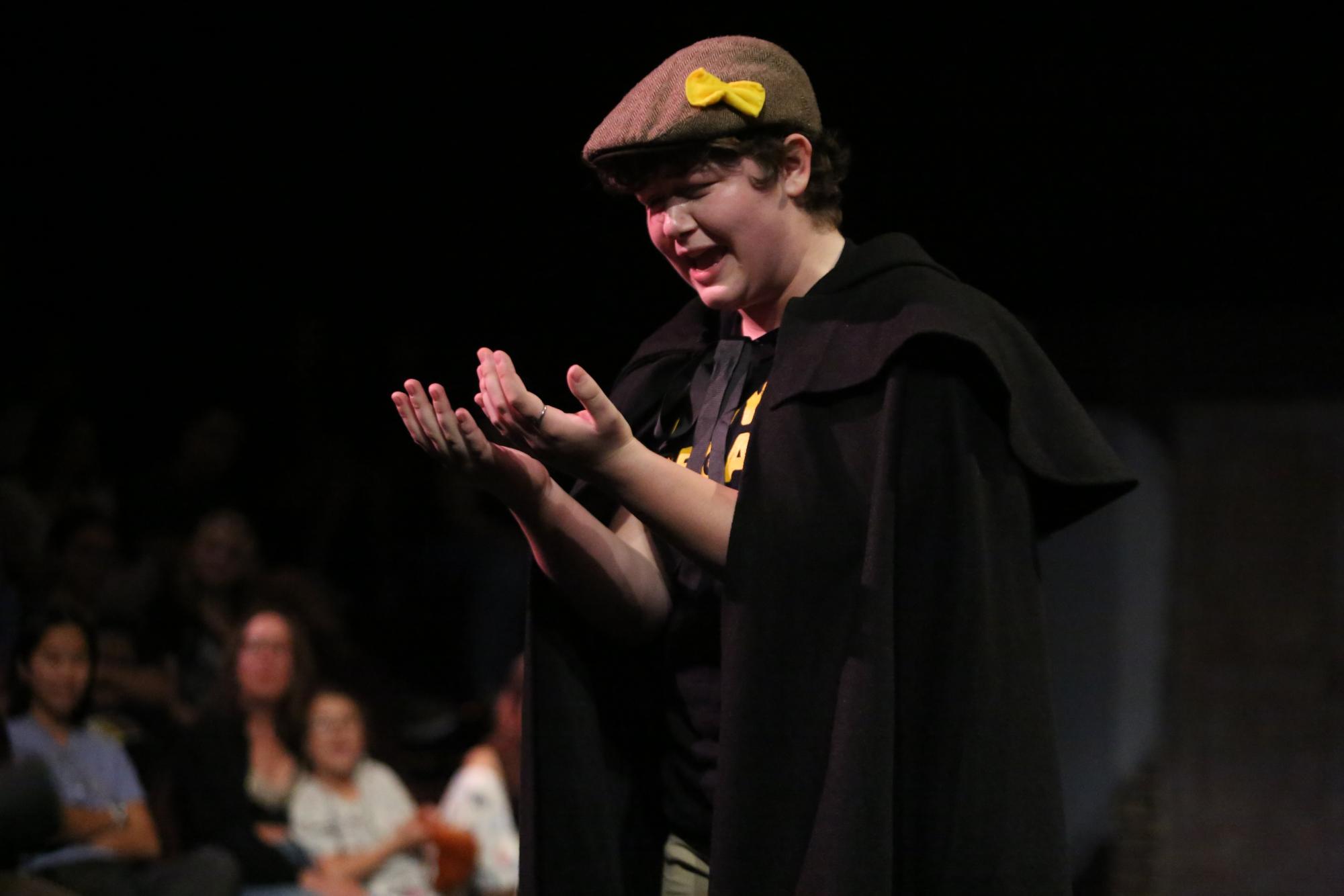 Junior Charlie Denbar delivers an emotional line as J. Finch in Puffs Oct. 17 at the Black Box Theater. Apart from being director of costuming for Junie B. Jones, he also was a key actor in Puffs.