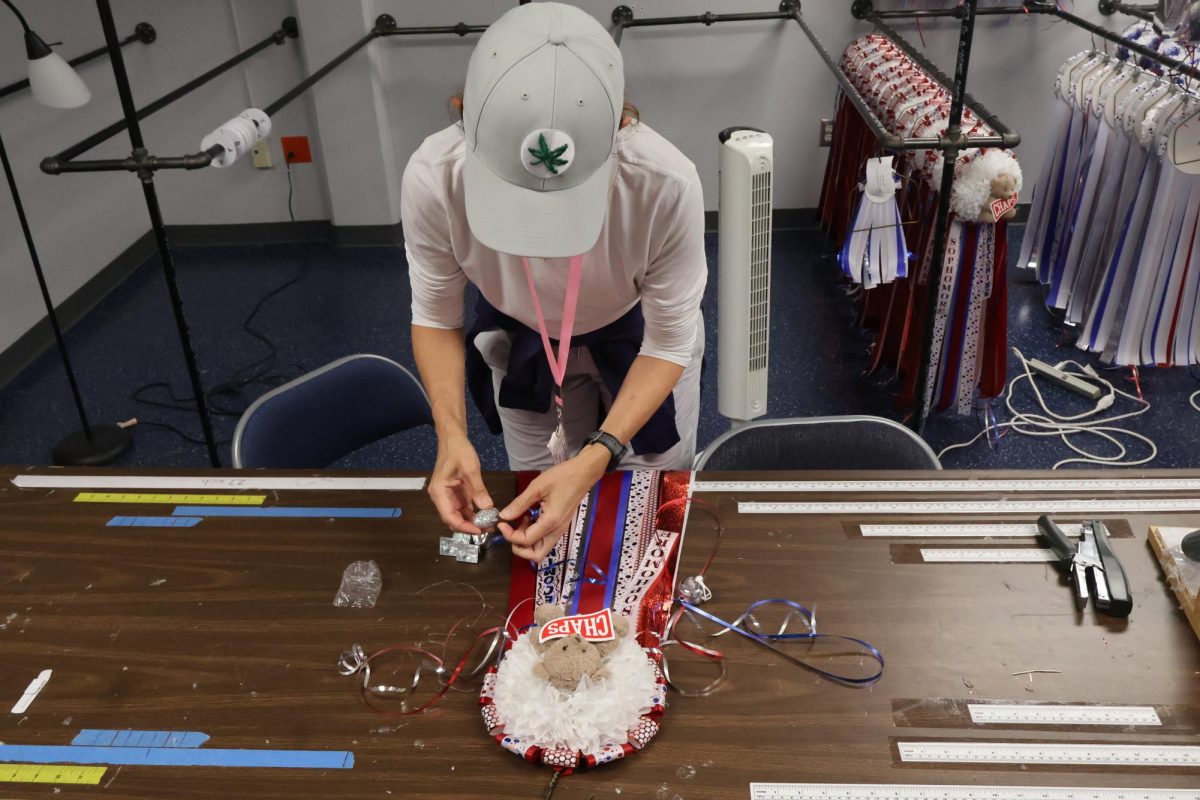 Mum moms put the final touches on mums Oct. 24. The mum moms prepare mums year-round.