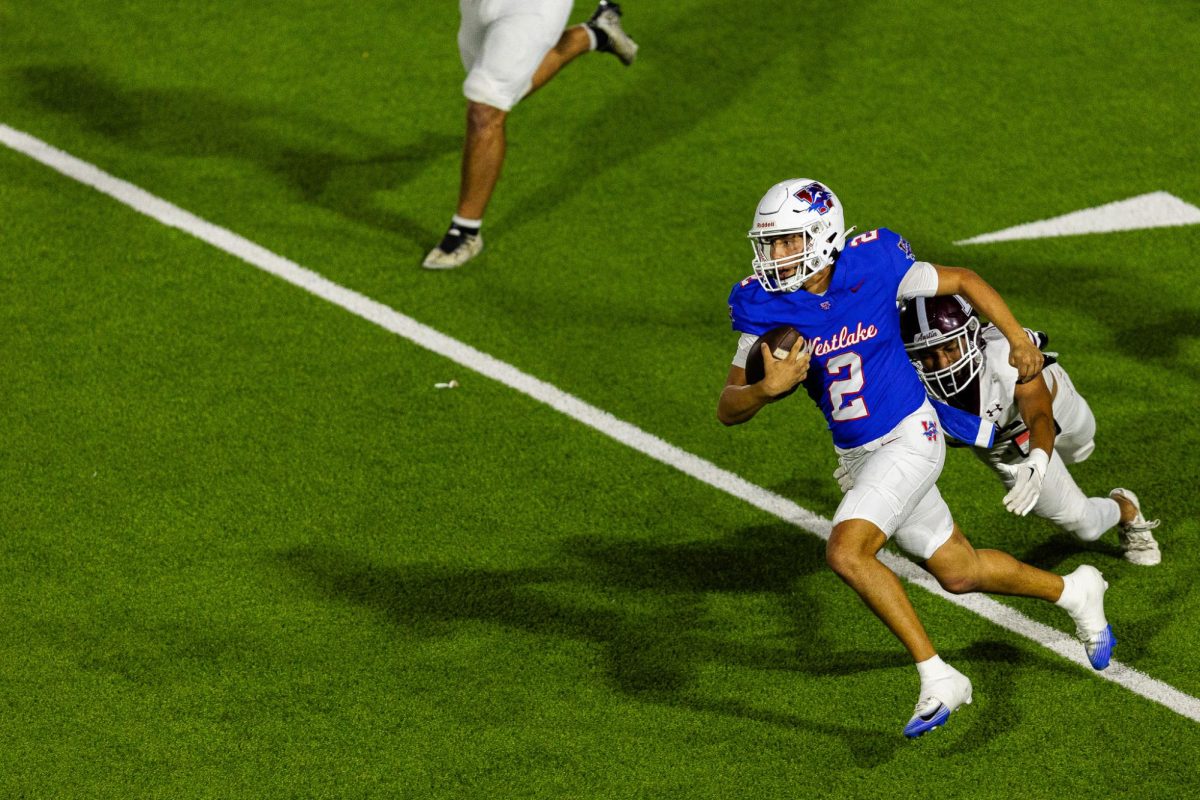 Senior quarterback Austin Knox breaks a tackle during the Chaparral’s victory over the Austin High Maroons at Chaparral Stadium Oct. 9. (Joe Nogalski/Westlake Featherduster)